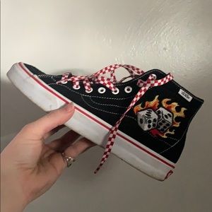 Vans, dice and flour leaf clover.